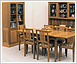 Classic dining table with lattice back chairs, dresser and tall cabinet